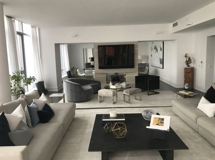 Penthouse — The second living area, with the media and fireplace wall built in flush between the glazing