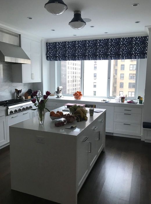 Upper Floor Residence — The same kitchen from the window side, the contrasting island set on the long axis